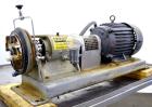 Used Tri-Clover Centrifugal Pump, Model SP218M-9237-40, 316 Stainless Steel. Unit missing front cover. Driven by a 10 hp, 3/60/460 volt, 3510 rpm motor. Mounted on a carbon steel base.