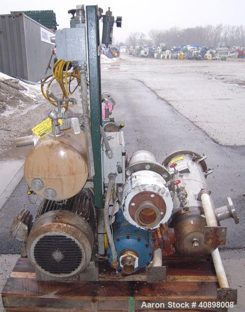 Used Busch Huckepack Two Stage Rotary Vane Vacuum Pump, Model 433:013. Rated 200 cfm at .5 Torr, with a 15 hp, 3/60/460 volt, 1765 rpm XP motor, knock out pot, receiver and heat exchanger. Serial #50...