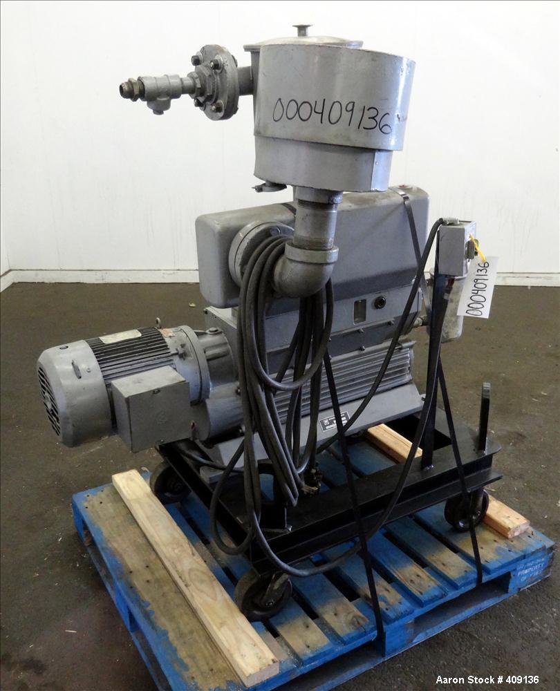 Used Leybold-Heraeus Two Stage Rotary Piston Vacuum Pump, 117.8 CFM, Model DK200, Carbon Steel. Driven by a 7.5hp, 3/60/230/460 volt, 1755 rpm motor. Mounted on a base with casters. Serial# 895031179...