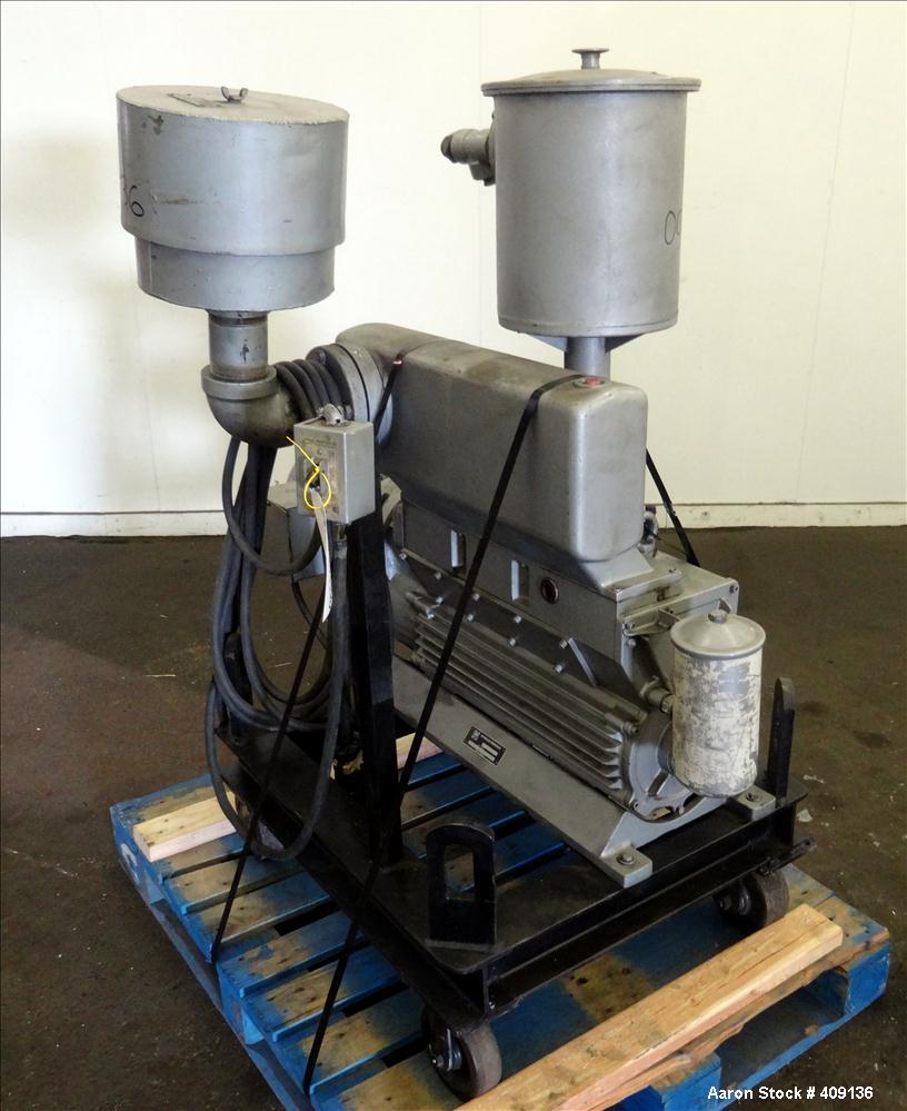 Used Leybold-Heraeus Two Stage Rotary Piston Vacuum Pump, 117.8 CFM, Model DK200, Carbon Steel. Driven by a 7.5hp, 3/60/230/460 volt, 1755 rpm motor. Mounted on a base with casters. Serial# 895031179...