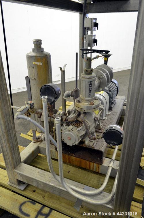 Used Nash Two Stage Liquid Ring Vacuum Pump, Model XL35/5, Carbon Steel. Approximate 100 CFM. Driven by a 10hp, 3/60/460 volt, 1755 rpm motor. Includes a tank. Base mounted.