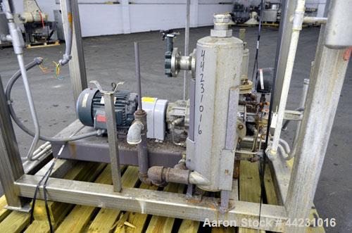 Used Nash Two Stage Liquid Ring Vacuum Pump, Model XL35/5, Carbon Steel. Approximate 100 CFM. Driven by a 10hp, 3/60/460 volt, 1755 rpm motor. Includes a tank. Base mounted.