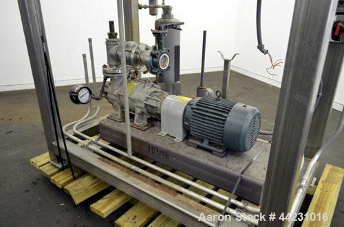 Used Nash Two Stage Liquid Ring Vacuum Pump, Model XL35/5, Carbon Steel. Approximate 100 CFM. Driven by a 10hp, 3/60/460 volt, 1755 rpm motor. Includes a tank. Base mounted.