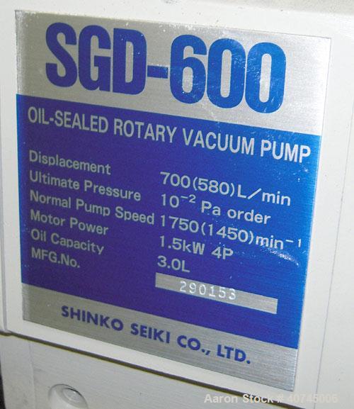 Used Shinko Seiki Oil Sealed Rotary Vacuum Pump, Model SGD-600, carbon steel. Approximate 24 cfm. Driven by a 1.5KW (2 hp), 4 pole, 200/220 volt, 1710/1720 rpm motor. Includes a Roots blower/booster,...