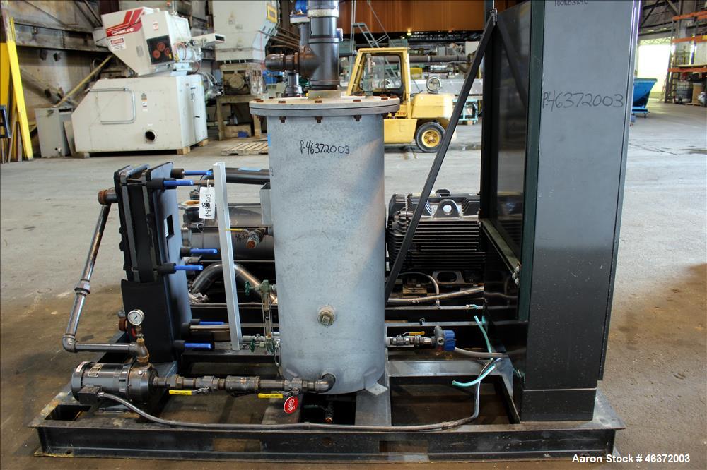 Used Travaini Vacuum System, Model TRW1000H-FR, Carbon Steel. Consisting of Travaini vacuum pump, model TRHE100-1600/X-C/F, serial #AC469-M0PXI, approximately 1000 CFM, 4" inlet/outlet, driven by 100...