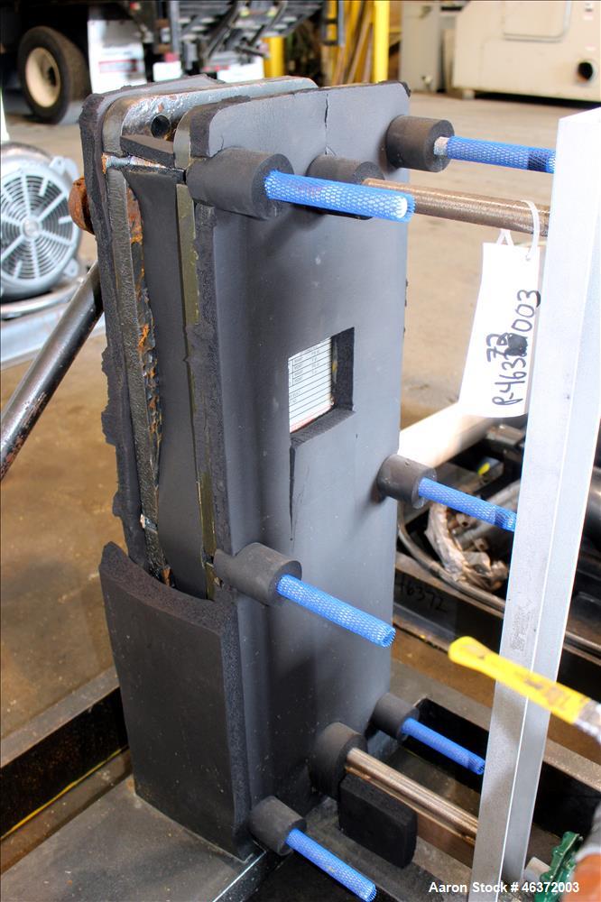Used Travaini Vacuum System, Model TRW1000H-FR, Carbon Steel. Consisting of Travaini vacuum pump, model TRHE100-1600/X-C/F, serial #AC469-M0PXI, approximately 1000 CFM, 4" inlet/outlet, driven by 100...