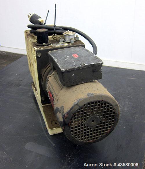 Used Varian Dual Stage Rotary Vane Vacuum Pump, Model SD-700, Part# 0424-P1241-301, Carbon Steel. Approximate 24 cfm. Driven by a 1.5hp, 1/60/115/230 volt, 1735 rpm motor.