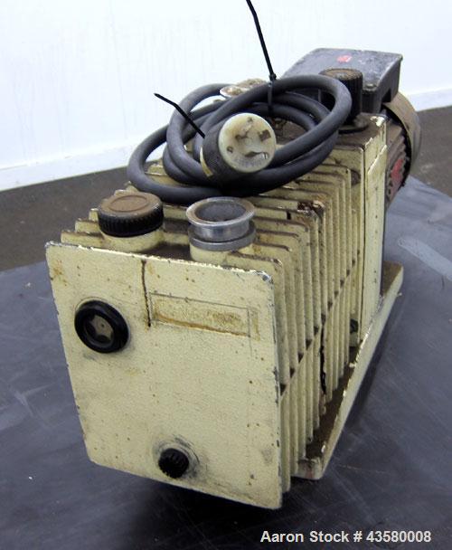 Used Varian Dual Stage Rotary Vane Vacuum Pump, Model SD-700, Part# 0424-P1241-301, Carbon Steel. Approximate 24 cfm. Driven by a 1.5hp, 1/60/115/230 volt, 1735 rpm motor.