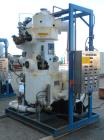 Used Apovac Vacuum System consisting of: (1) Vacuum pump, driven by a 30 hp motor. (1) Industrial Piping heat exchanger, (1) Industrial Piping pressure tank, and a control panel. Mounted on a carbon ...