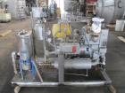 Busch Huckepack Vacuum Pump, Model 437-002. Rated 310 cfm at 0.5 Torr. Driven by 20hp, 230/460 volt XP motor. Skid mounted with silencer, heat exchanger, basket filter, separator and oil pot, serial#...