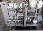 Used Busch Huckepack Vacuum Pump, Model HO437-D8095. Rated 282 cfm at 0.5 Torr, driven by 20hp, 230/460 volt XP motor. Skid mounted with silencer, heat exchanger, basket filter and oil pot, serial# 8...