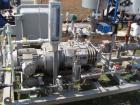 Used Busch Single Stage Cobra Dry Screw Vacuum Pump, Model NC0070ABM6.000F, carbon steel. Rated 58 cfm, 0.075’’ Torr., air cooled. Driven by a 5 hp, 3/20-60/460 volt, 3505 rpm XP motor. Includes an X...