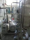Used- Busch vacuum pump system, Model NC0250 ABM6.000F, with RAS steel condenser, installed 2010