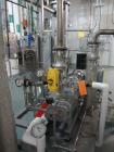 Used Busch vacuum pump system, Model NC0250 ABM6.000F, with RAS steel condenser, installed 2010