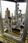 Used Nash Two Stage Liquid Ring Vacuum Pump, Model XL35/5, Carbon Steel. Approximate 100 CFM. Driven by a 10hp, 3/60/460 volt, 1755 rpm motor. Includes a tank. Base mounted.