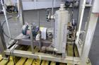 Used Nash Two Stage Liquid Ring Vacuum Pump, Model XL35/5, Carbon Steel. Approximate 100 CFM. Driven by a 10hp, 3/60/460 volt, 1755 rpm motor. Includes a tank. Base mounted.