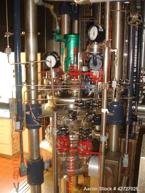 Used Northland Stainless Reactor Train, 50 Liter (13.2 Gallon). With 50 liter Hastelloy C22 reactor, removable dish top, dish bottom, intermediate QVF glass mid section, rated 150 psi and full vacuum...