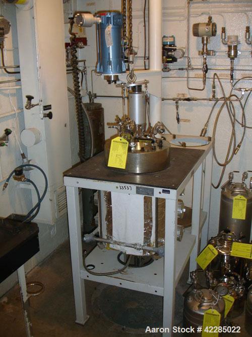 Used Parr Reactor, 5 Gallon, Hastelloy C. Internal rated 2000 psi at 350 deg F. Electrically heated. Mounted on a  stand with a Parr magnetic agitator drive. Serial  #4555. Price includes 15% buyer's...