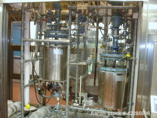Used Buchi Reactor Train consisting of: (1) Buchi 70 liter glass reactor, removable dish top, dish bottom. Internal rated -1/+0.5 bar (-14.5/7.2 psig) +200/-50 deg C, jacket rated 10 bar (145 psig) a...