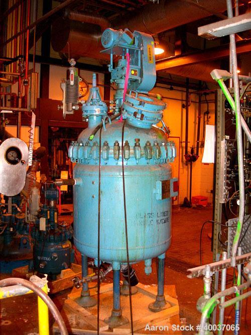 Used: Pfaudler glass lined clamp top reactor, 100 gallon, 5015 glass, vertical. Approximately 36" diameter x 36" straight side, clamp dished top, dished bottom. Internal rated 100/fv psi at 450 deg.f...