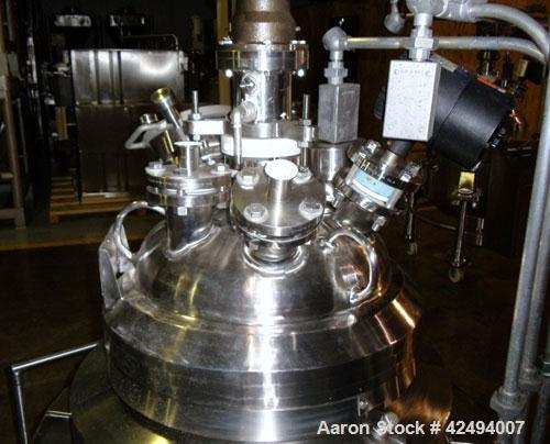 Used Pfaudler Glass Lined Reactor, 30 Gallon. Dished top, coned bottom. Internal rated 100 psi & FV at 450/-100 degrees F, stainless steel jacket rated 90 psi at 350/-100 degrees F.. Pfaudler DTW agi...