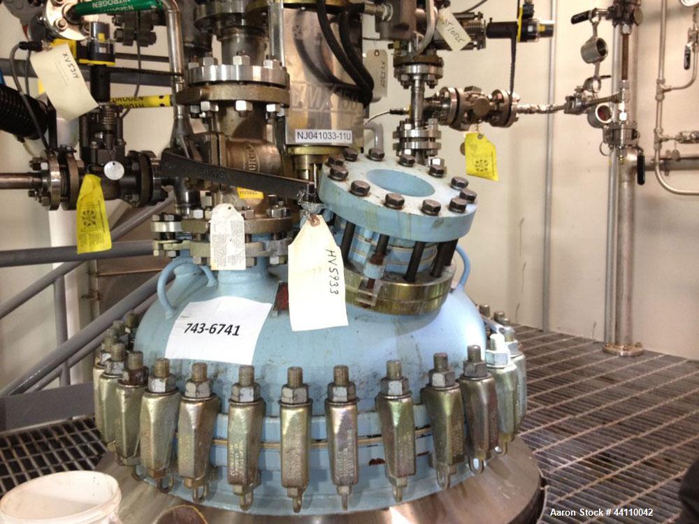 Used Pfaudler Glass Lined Reactor, 100 Gallon. Internal rated 300 psi & Full Vacuum at 450 degrees F, jacket rated 150 psi & Full Vacuum at 450 degrees F.  Type 9119 Dark Blue Glass.  Clamped top. 31...