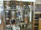 Used Buchi Reactor Train consisting of: (1) Buchi 100 Liter Glass Reactor, (1) Buchi 100 Liter Glass Agitated Receiver, (2) Vertical Glass Coil Condensers, (1) Vertical Coil Vent Condenser. 