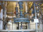 Used Buchi Reactor Train consisting of: (1) Buchi 100 Liter Glass Reactor, (1) Buchi 100 Liter Glass Agitated Receiver, (2) Vertical Glass Coil Condensers, (1) Vertical Coil Vent Condenser. 