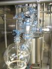 Used Buchi Glass Reactor, 100 Liter (26.4 Gallon). Internal rated +0.4/-1.0 bar at +200/-85 degrees C, jacket rated +10/-1.0 bar at +200/-85 degrees C. Bolted glass dished top and bottom. 3-blade tur...