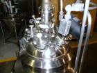 Used Pfaudler Glass Lined Reactor, 30 Gallon. Dished top, coned bottom. Internal rated 100 psi & FV at 450/-100 degrees F, stainless steel jacket rated 90 psi at 350/-100 degrees F.. Pfaudler DTW agi...