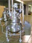 Used Pfaudler Glass Lined Reactor, 30 Gallon. Dished top, coned bottom. Internal rated 100 psi & FV at 450/-100 degrees F, stainless steel jacket rated 90 psi at 350/-100 degrees F.. Pfaudler DTW agi...
