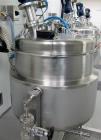 Used 300 liter HM Rustfri kettle, stainless steel construction, jacketed for 2.7 bar(39 psi at 150 c, top entering .75 kw Ekato agitator, model FGL-25D, on 2 legs, serial# FS-1210B, built 2011.