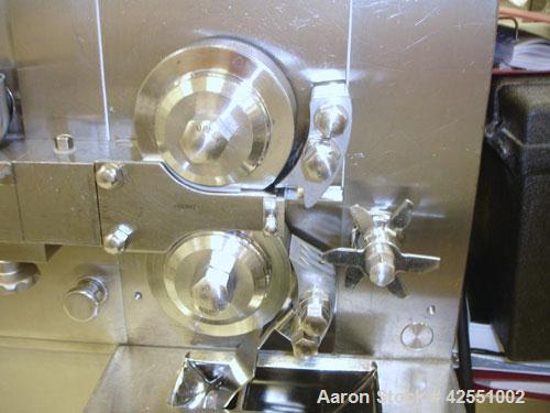 Used Alexanderwerk Roller Compactor, Model WP120V Pharma, Stainless Steel. Horizontal screw feeder with pre-breaker, cantilevered rolls, flake crusher, pre-granulator and fine granulator attachments,...