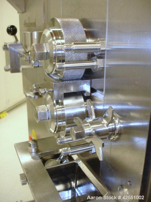 Used Alexanderwerk Roller Compactor, Model WP120V Pharma, Stainless Steel. Horizontal screw feeder with pre-breaker, cantilevered rolls, flake crusher, pre-granulator and fine granulator attachments,...