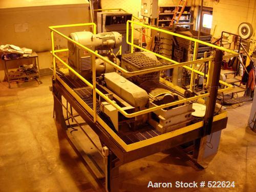 USED: Bepex K & G model MS briquette press. Stainless steel rolls(2) 20.5" diameter x 4" face. The rolls are 2 pockets wide with 2 rows of 32 pockets around the circumference. The rolls have pillowsh...