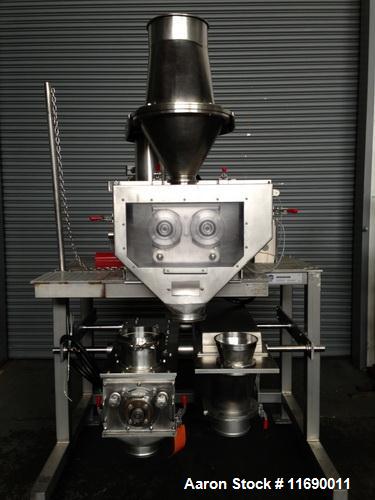 Used Hosokawa Bepex Roller Compactor, 50 mm Wide x 200 mm Long Rolls, Model Pharmapaktor L200/50P.  This system is approximately 68" wide x 64" x 94" high.  After compacting, the material discharges ...