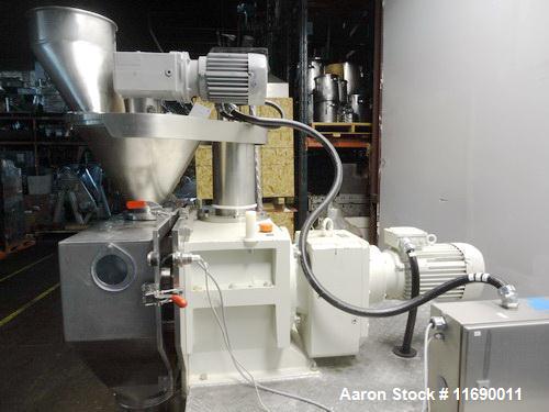 Used Hosokawa Bepex Roller Compactor, 50 mm Wide x 200 mm Long Rolls, Model Pharmapaktor L200/50P.  This system is approximately 68" wide x 64" x 94" high.  After compacting, the material discharges ...