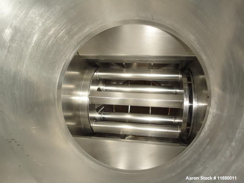 Used Hosokawa Bepex Roller Compactor, 50 mm Wide x 200 mm Long Rolls, Model Pharmapaktor L200/50P.  This system is approximately 68" wide x 64" x 94" high.  After compacting, the material discharges ...