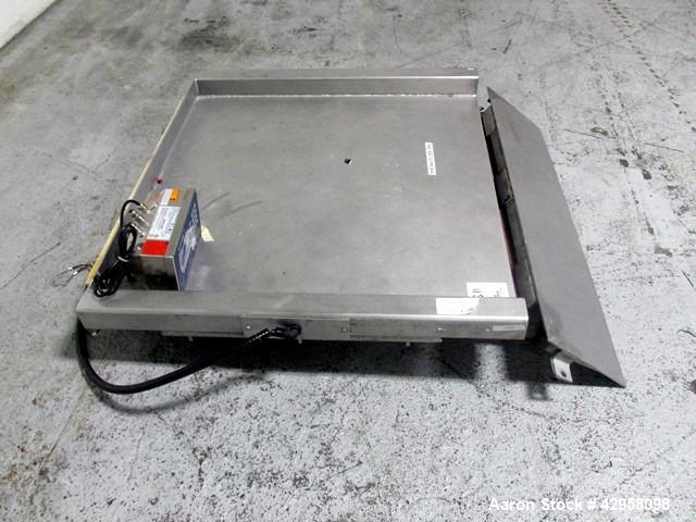 Used Indiana Scale Floor Scale. 42" x 42" Platform, stainless steel construction, 2000 pound capacity with Mettler-Toledo readout/controls, with ramp.