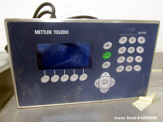 Used Indiana Scale Floor Scale. 42" x 42" Platform, stainless steel construction, 2000 pound capacity with Mettler-Toledo readout/controls, with ramp.
