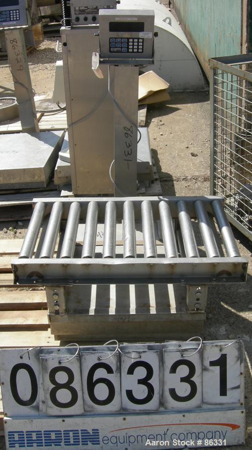 USED: Fairbanks platform scale, 1000 pound capacity, model H90-165. 23" x 27" 304 stainless steel platform. Includes a GSE model 550 readout. Mounted on casters.