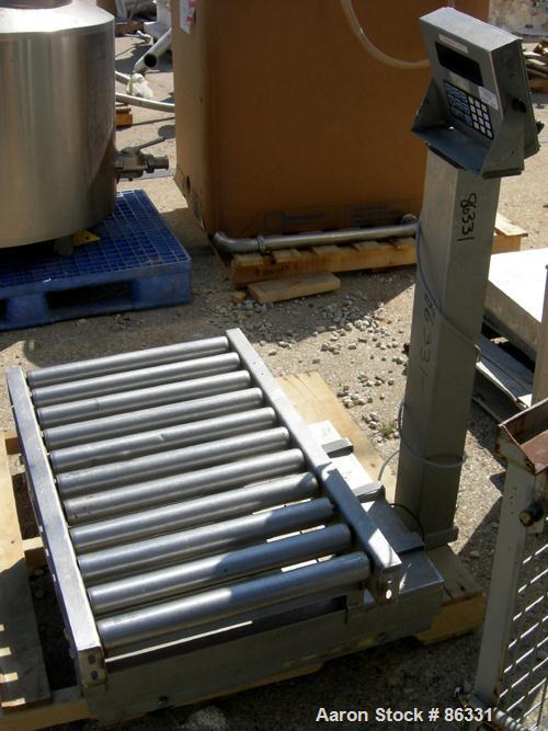 USED: Fairbanks platform scale, 1000 pound capacity, model H90-165. 23" x 27" 304 stainless steel platform. Includes a GSE model 550 readout. Mounted on casters.