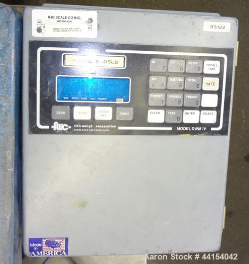 Used- Indiana Platform Scale, Model SB-18X24, serial# 27286. Approximate 250 pound capacity, with a FWC model DWM-IV readout...
