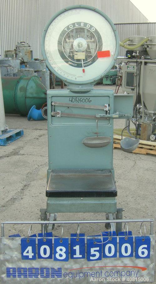Used Toledo Scale, Model 2081. 125 pound capacity. 20'' x 20'' platform. Mounted on a cart with casters.