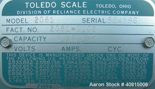 Used Toledo Scale, Model 2081. 125 pound capacity. 20'' x 20'' platform. Mounted on a cart with casters.