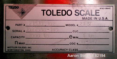 USED: Toledo floor scale, model 2157. 2000 pound capacity, 48" x 48" diamond plate base. Includes a GSE model 350 readout.