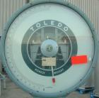 Used Toledo Scale, Model 2081. 125 pound capacity. 20'' x 20'' platform. Mounted on a cart with casters.