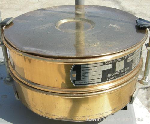 Used W.S Tyler sieve shaker, model RX-24. (1) 8" diameter brass screen, #7 mesh size. (1) 8" diameter bottom collection pan. Driven by a 1/3 hp, 1/60/115 volt, 1725 rpm motor.



