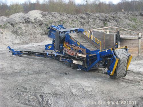 Used Fintec 640 3-way heavy duty scalping screen, mobile, with steel apron feeder, screen box 3650 x 1500 mm (12' x 5'), top deck with tines 100 mm (4"), drum diameter 400 mm (16"). 74 kW (99 hp) die...