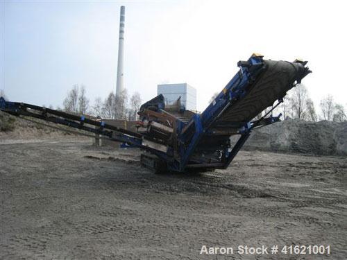 Used Fintec 640 3-way heavy duty scalping screen, mobile, with steel apron feeder, screen box 3650 x 1500 mm (12' x 5'), top deck with tines 100 mm (4"), drum diameter 400 mm (16"). 74 kW (99 hp) die...